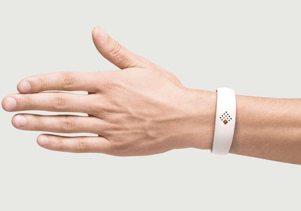 White AMBRIO bracelet on the hand of a man for mobile